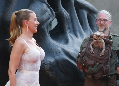 Mandatory Credit: Photo by John Angelillo/UPI/Shutterstock (15370977h)Scarlett Johansson and the mechanical dinosaur character Dolores the Aquilops arrive on the red carpet for the "Jurassic World Rebirth" New York Premiere at Lincoln Center on Monday June 23, 2025 in New York City.Jurassic World Rebirth Premiere, New York, United States - 23 Jun 2025