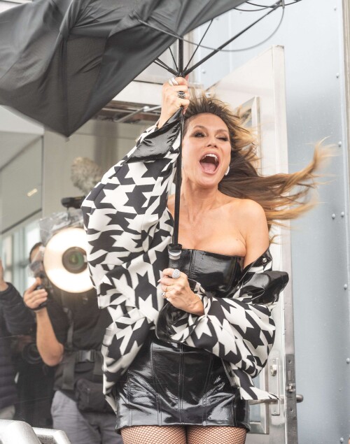 Mandatory Credit: Photo by Lev Radin/Shutterstock (15642319ag)Heidi Klum visits the Empire State Building in New York, NY on October 30, 2025 for ceremonial lighting in orange to celebrate Halloween. On the observation deck was heavy rain and strong wind as Heidi Klum struggle to hold an umbrella.Heidi Klum lights up the Empire State Building to celebrate Halloween, New York, United States - 30 Oct 2025/shutterstock_editorial_Heidi_Klum_lights_up_the_Empi_15642319ag//2510311434