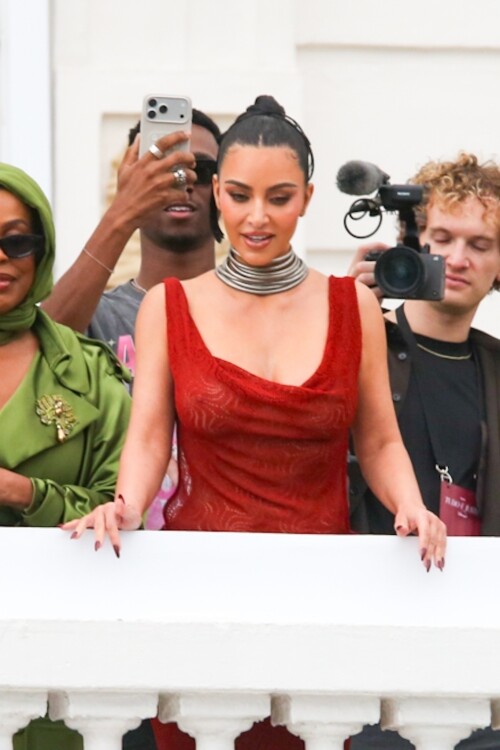 *EXCLUSIVE* Rio de Janeiro, BRAZIL    Kim Kardashian was seen on the balcony of Rios Copacabana Palace with the cast of Alls Fair, looking stunning in a very long, red-hot dress before taking her heels for a perilous spin on the cobblestone streets below  where even her security appeared to need backup. The reality star, usually all smiles for the cameras, kept her head down as she focused on every careful step. Between the uneven terrain and the sweeping length of her gown, Kim had her hands (and heels) full as she navigated Rio in sky-high platforms.Pictured: Kim Kardashian, Niecey NashBACKGRID USA 11 NOVEMBER 2025 BYLINE MUST READ: Dilson Silva / BACKGRIDUSA: +1 310 798 9111 / usasales@backgrid.comUK: +44 208 344 2007 / uksales@backgrid.com*UK Clients - Pictures Containing ChildrenPlease Pixelate Face Prior To Publication*