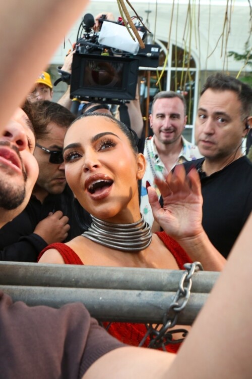 *EXCLUSIVE* Rio de Janeiro, BRAZIL    Kim Kardashian was seen on the balcony of Rios Copacabana Palace with the cast of Alls Fair, looking stunning in a very long, red-hot dress before taking her heels for a perilous spin on the cobblestone streets below  where even her security appeared to need backup. The reality star, usually all smiles for the cameras, kept her head down as she focused on every careful step. Between the uneven terrain and the sweeping length of her gown, Kim had her hands (and heels) full as she navigated Rio in sky-high platforms.Pictured: Kim KardashianBACKGRID USA 11 NOVEMBER 2025 BYLINE MUST READ: Dilson Silva / BACKGRIDUSA: +1 310 798 9111 / usasales@backgrid.comUK: +44 208 344 2007 / uksales@backgrid.com*UK Clients - Pictures Containing ChildrenPlease Pixelate Face Prior To Publication*