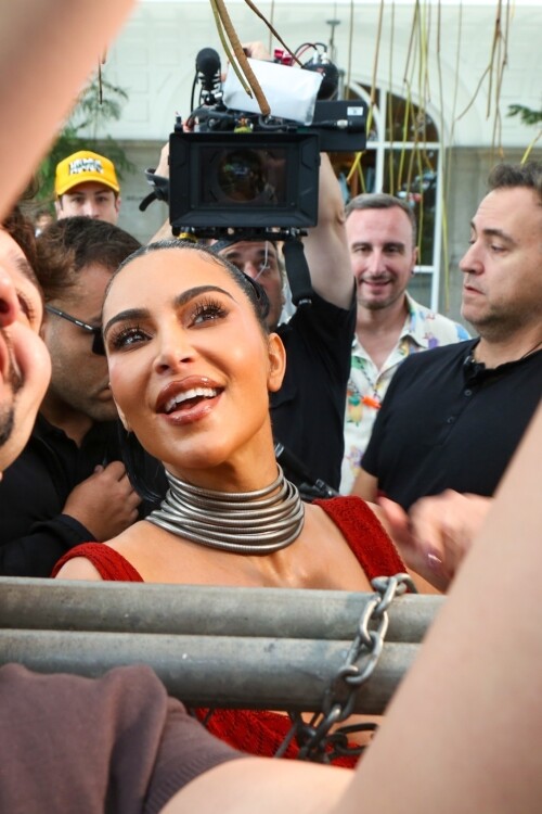 *EXCLUSIVE* Rio de Janeiro, BRAZIL    Kim Kardashian was seen on the balcony of Rios Copacabana Palace with the cast of Alls Fair, looking stunning in a very long, red-hot dress before taking her heels for a perilous spin on the cobblestone streets below  where even her security appeared to need backup. The reality star, usually all smiles for the cameras, kept her head down as she focused on every careful step. Between the uneven terrain and the sweeping length of her gown, Kim had her hands (and heels) full as she navigated Rio in sky-high platforms.Pictured: Kim KardashianBACKGRID USA 11 NOVEMBER 2025 BYLINE MUST READ: Dilson Silva / BACKGRIDUSA: +1 310 798 9111 / usasales@backgrid.comUK: +44 208 344 2007 / uksales@backgrid.com*UK Clients - Pictures Containing ChildrenPlease Pixelate Face Prior To Publication*