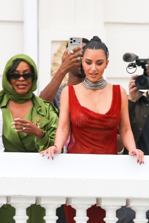 *EXCLUSIVE* Rio de Janeiro, BRAZIL    Kim Kardashian was seen on the balcony of Rios Copacabana Palace with the cast of Alls Fair, looking stunning in a very long, red-hot dress before taking her heels for a perilous spin on the cobblestone streets below  where even her security appeared to need backup. The reality star, usually all smiles for the cameras, kept her head down as she focused on every careful step. Between the uneven terrain and the sweeping length of her gown, Kim had her hands (and heels) full as she navigated Rio in sky-high platforms.Pictured: Kim Kardashian, Niecey NashBACKGRID USA 11 NOVEMBER 2025 BYLINE MUST READ: Dilson Silva / BACKGRIDUSA: +1 310 798 9111 / usasales@backgrid.comUK: +44 208 344 2007 / uksales@backgrid.com*UK Clients - Pictures Containing ChildrenPlease Pixelate Face Prior To Publication*